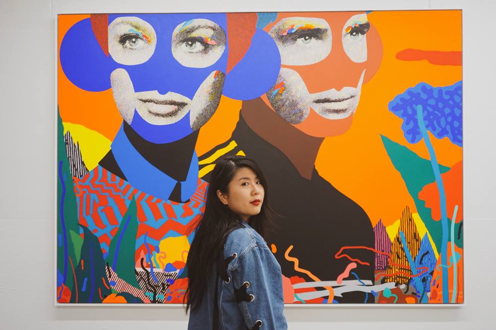 Katherine standing in front of a painting